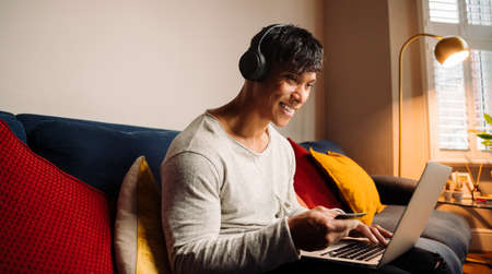 Young Asian man making credit card paymentの写真素材