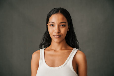 Close up attractive smiling multiethnic female in the studioの写真素材