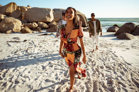 A Laughing Woman Waling on the Beachの写真素材