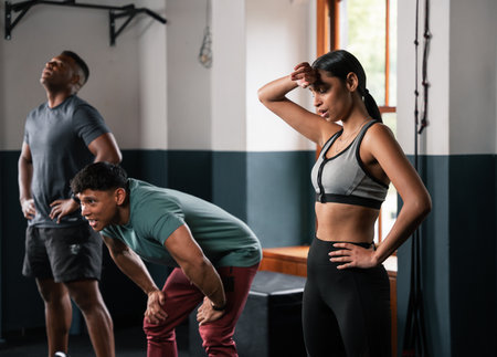 People in the gym exercising arms, legs, chest, and waist