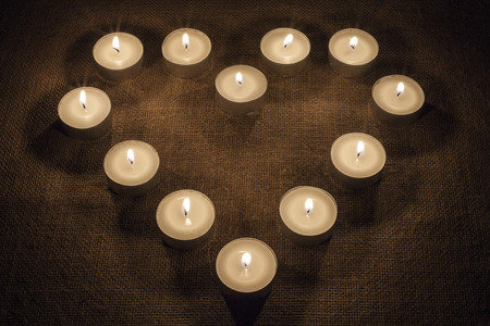 A heart made of candlesの写真素材