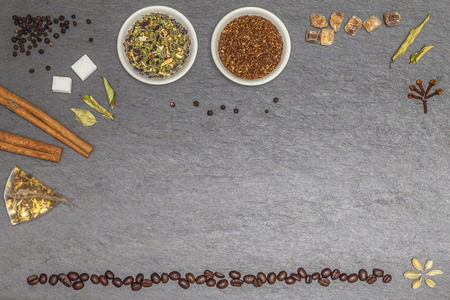 Collecion of several sorts of tea spices and coffe beans with free space for text or logoの写真素材