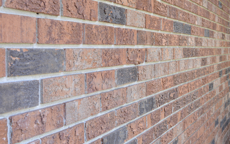 image of a red brick wall fading away from view