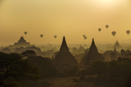 Hot air balloons floating on the pagoda in the territory of ancient civilizations, city of Baganの写真素材