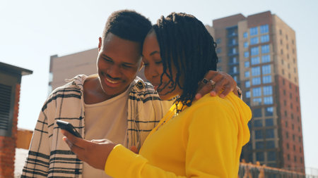 Romantic, loving couple on a city street having funの写真素材