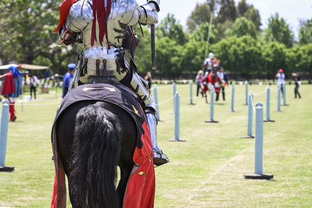 Two knights compete during re-enactment of medieval jousting tournamentの写真素材