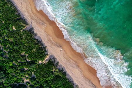 Beach aerial view from drone beach shadow people sunriseの写真素材