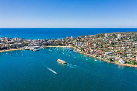 Aerial view on famous Manly Wharf and Manly, Sydney, Australia. View on Sydney harbourside suburb from above. Aerial view on Sydney North Harbour, Manly and Manly Wharf.の写真素材
