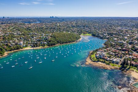 Aerial view on Reef Bay, Sydney, Australia. View on Sydney harbourside suburb from above. Aerial view on Forty Baskets Beach, Reef Bay and Sydney in the background.の写真素材