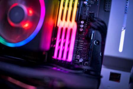 Close up of a computer motherboard, RGB memory and RGB CPU fanの写真素材
