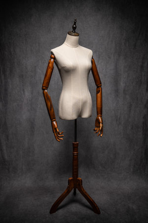 Wooden female dressmakers mannequin, retro style with arms and adjustable standの写真素材