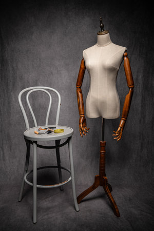 Wooden female dressmakers mannequin, retro style with arms and adjustable standの写真素材