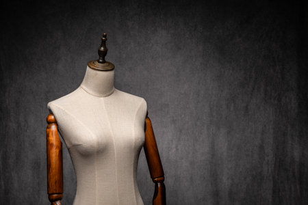 Wooden female dressmakers mannequin, retro style with arms and adjustable standの写真素材