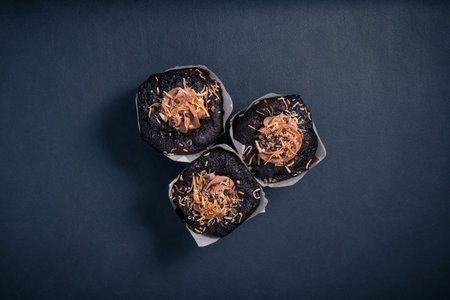 Chocolate muffin on dark background. Top view.の写真素材