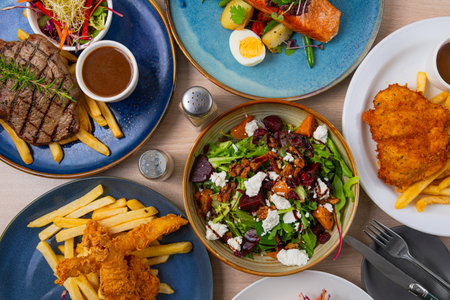 Fresh tasty food. Set of dishes on the table, on a wooden background. Top view.の写真素材