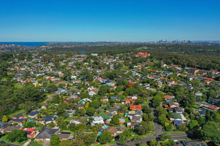 Panoramic drone aerial photo of a residential area in the Northern Beaches, with city in the distance, Sydney, Australia.の写真素材