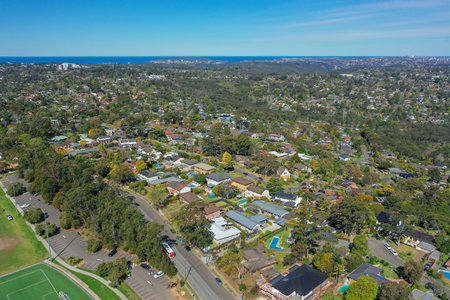 Panoramic drone aerial photo of a residential area in the Northern Beaches, with Northern Beaches Hospital and Manly in the distance, Sydney, Australia.の写真素材