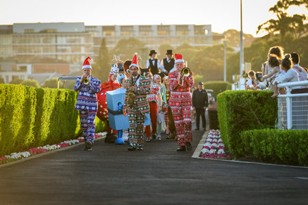 Sydney, Australia - December 4th, 2020: Horse racing spectators watch a Christmas Parade during the Royal Randwick Christmas Festival at Royal Randwick racecourse.のeditorial素材