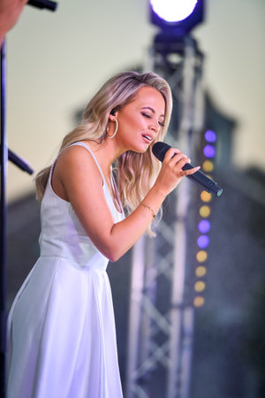 Sydney, Australia - December 4th, 2020: Samantha Jade performs on the stage during the Royal Randwick Christmas Festival at Royal Randwick racecourse.のeditorial素材