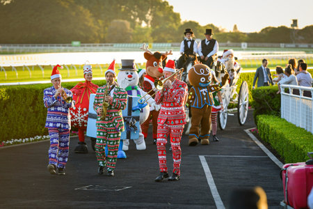 Sydney, Australia - December 4th, 2020: Horse racing spectators watch a Christmas Parade during the Royal Randwick Christmas Festival at Royal Randwick racecourse.のeditorial素材