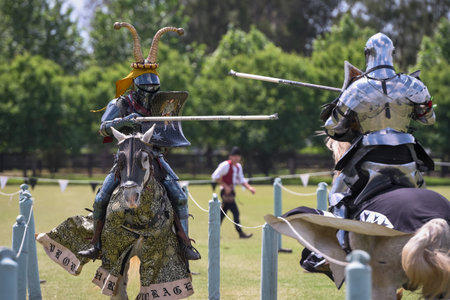 Knight jousting. Medieval knights during a jousting tournament. Knights competition.の写真素材