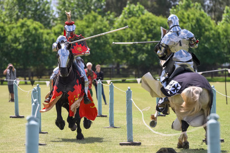 Knight jousting. Medieval knights during a jousting tournament. Knights competition.の写真素材