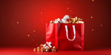 Santa claus bag full of gifts and decorations on red background, copy space. Merry Christmas shopping concept.の写真素材