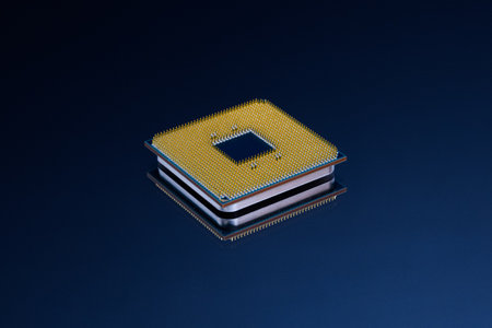 CPU Central Processing Unit or microchip computer isolated on dark blue background. Pin side of a CPU processor.の写真素材