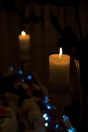 Burning candle in the dark の写真素材