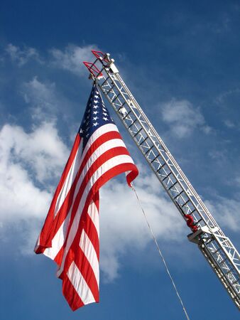 Flag on a fire truck ladderの写真素材