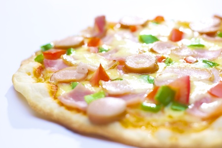 Pizza with Ham, Mushroom, Bacon, Onion, Green pepper, Tomato   Cheeseの写真素材