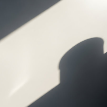 Diagonal shadow patterns on white wall, abstract light play, minimalist aesthetic, natural window light effectの素材