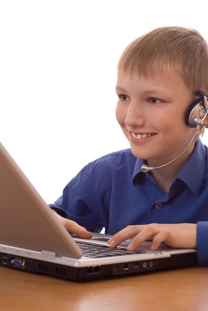 boy in the blue shirt sitting at a laptopの写真素材