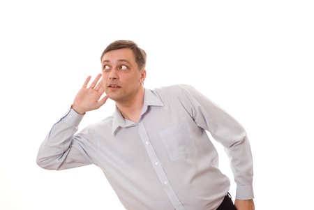 man stands and listens on a white backgroundの写真素材