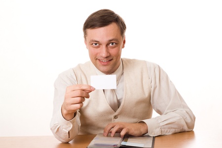 handsome young businessman shows the business card on a white backgroundの写真素材