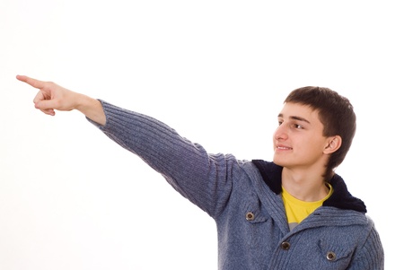 handsome young teenager standing on a whiteの写真素材