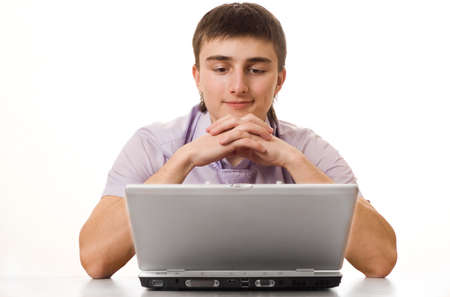 businessman in a purple shirt for a laptop on a white backgroundの写真素材