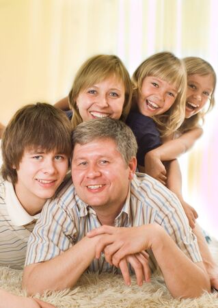 happy family of five on a light backgroundの写真素材