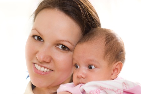 woman holding in her arms a newbornの写真素材
