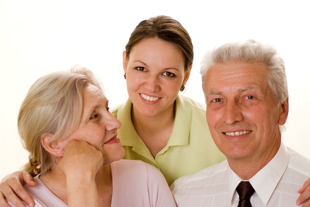 elderly couple with a daughter on a whiteの写真素材