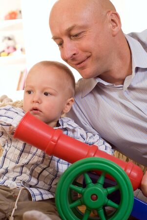 nice boy and his father on a white backgroundの写真素材