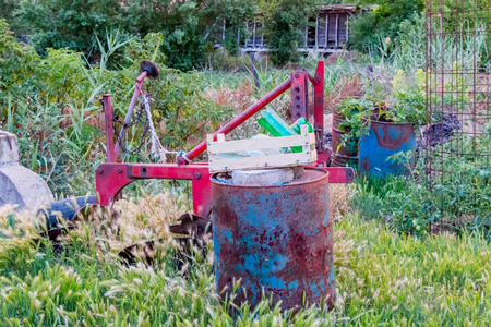 Old agriculture machine and large amounts of rubbish on the country side, Serbiaの写真素材