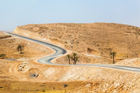 The desert road in the south of Tunisia, Africaの写真素材