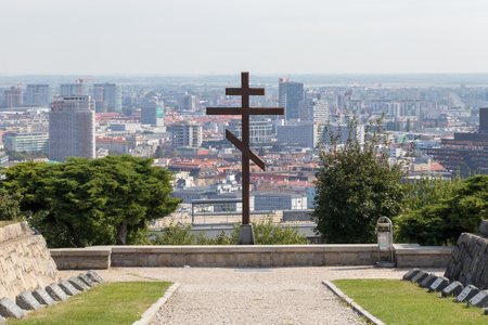 Christian cross in Slavin on background skyline of Bratislavaの写真素材