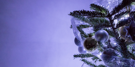 Close up of purple ornaments on Christmas treeの写真素材
