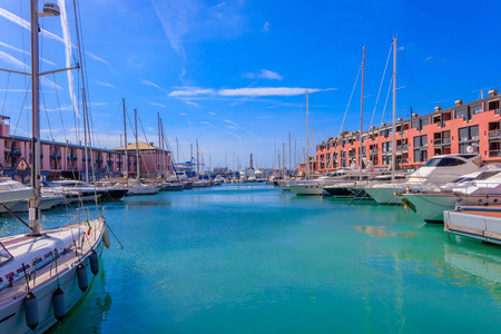 Port Porto Antico harbor with the lighthouse and luxury yachts in Genoa, Italyのeditorial素材
