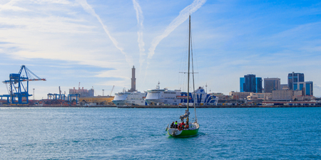 Sailing yacht in Porto Antico, Lighthouse of Genoa, Italyのeditorial素材