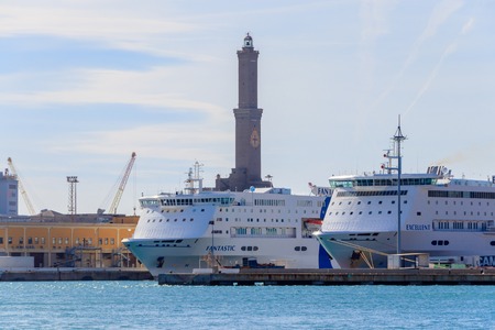 Two luxury Cruise Ships in front of the lighthouse in Genoa, Italyのeditorial素材