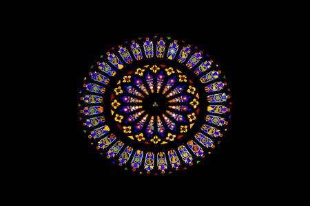 Stained sun shaped glass windows in Cathedral of Como, Italy
