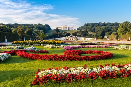 View on Schonbrunn Palace and garden with colorful flowers, Austrian flag made of flowers, Vienna, Austria - September 3, 2019のeditorial素材